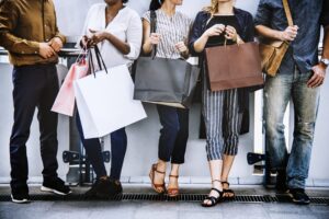 Group of Friends Out Shopping Together, standing in a line