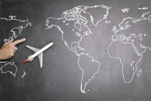 Airplane Over World Map On Blackboard 3769118