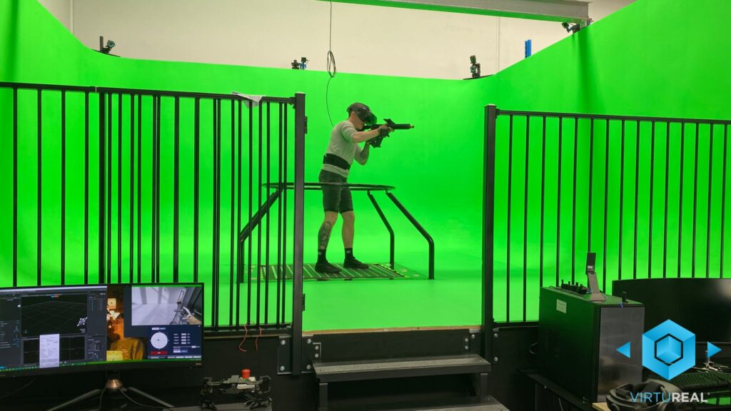 VirtuReal demonstration - man in VR headset and standing on omnidirectional treadmill in a green screened room testing virtual reality capabilities