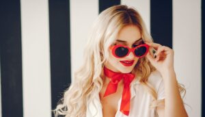 Stylish blonde girl Red Lipstick and sunglasses