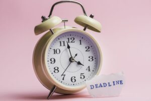 Deadline Text Torn Paper Near Yellow Clock Against Pink Background